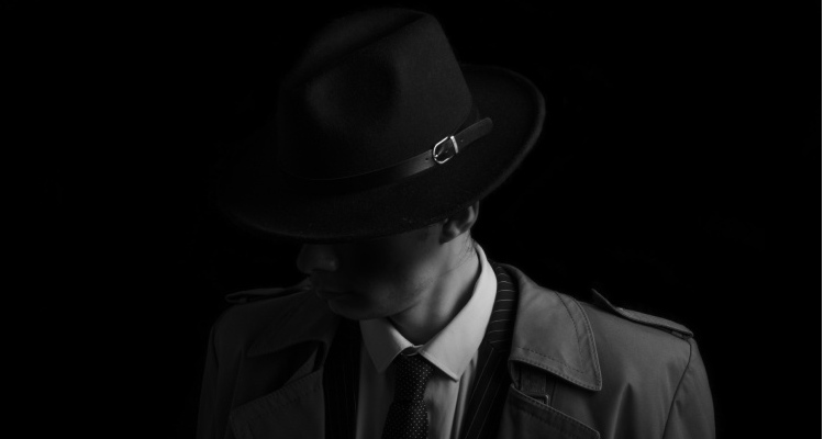 Uma imagem que ilustra uma pessoa com chapéu preto